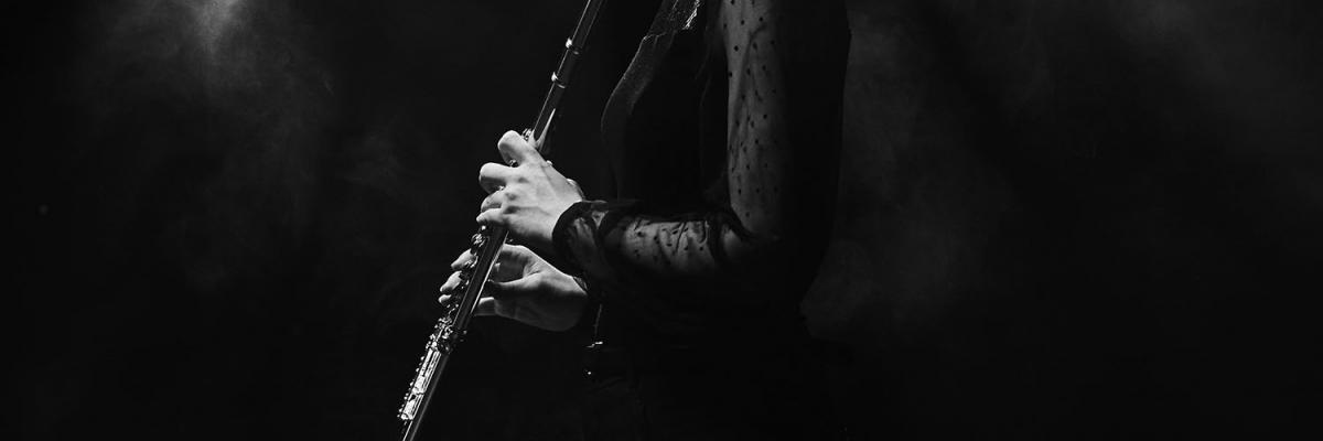 Student playing clarinet in studio